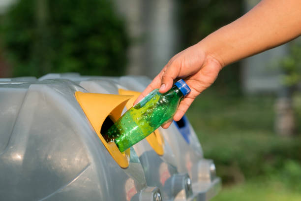 istock man hand putting plastic reuse for recycling concept environmental protection world recycle 1020158576