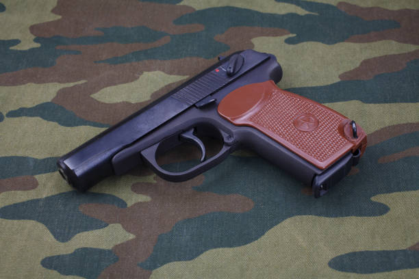 istock 9mm russian handgun on russian camouflage uniform 1020163602