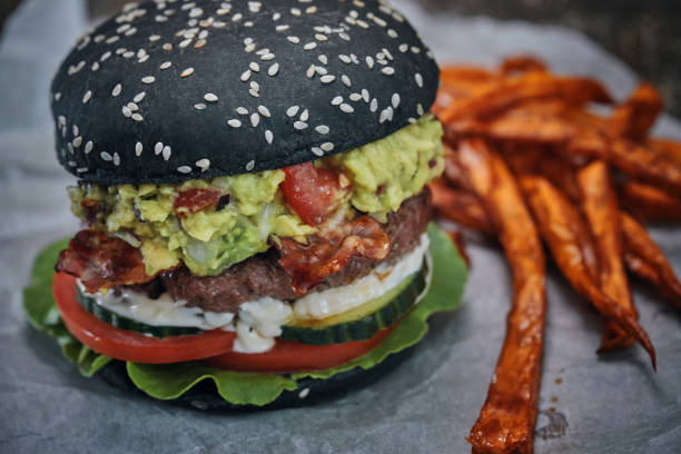istock Mexican Black Burger Buns with Beef Pattie, Guacamole, Tomato and Lettuce 1020163988
