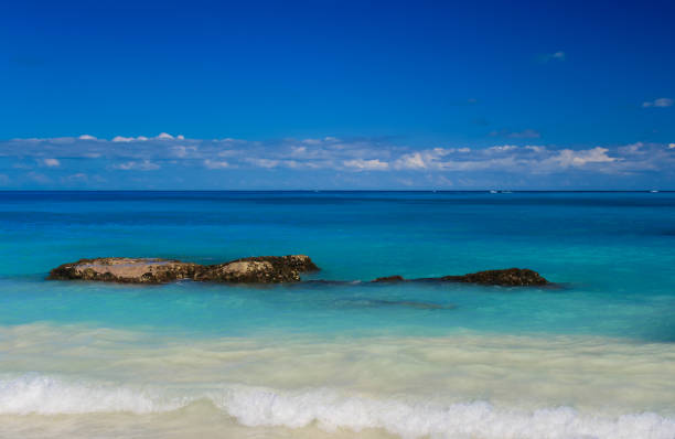 istock Caribbean Sea with Waves Breaking on a Seashore, Blue and Turquoise Water and Blue Sky, Cancun, Mexico. 1020166708