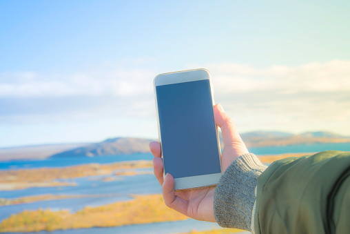 Traveler Making Selfie Mobile Phone  at Thingvellir national park, Iceland