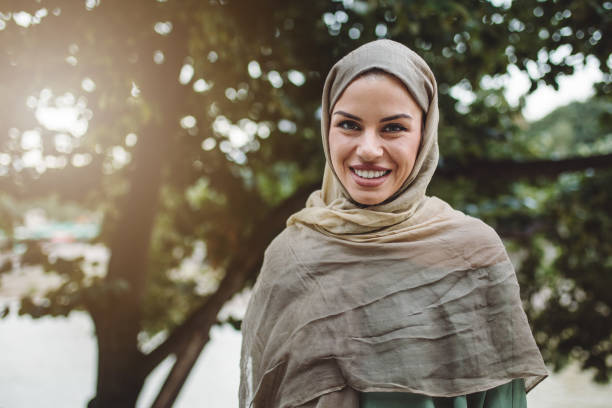 istock Gorgeous smiling Muslim woman standing outdoors on a sunny day 1020170410