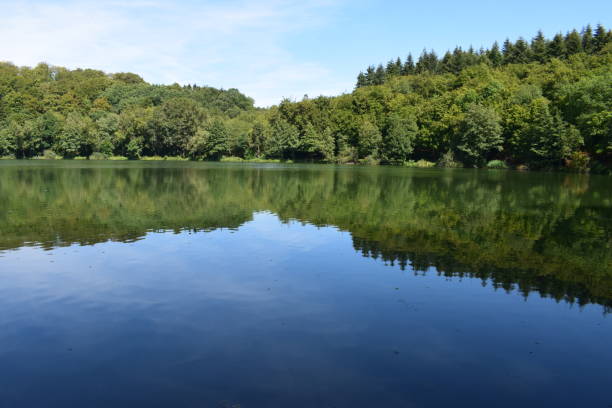istock caldera lake 'Holzmaar' in Eifel region 1020170570