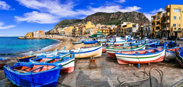 Photo of Traditional fishing village Aspra with colorful boats in Sicily. Italy