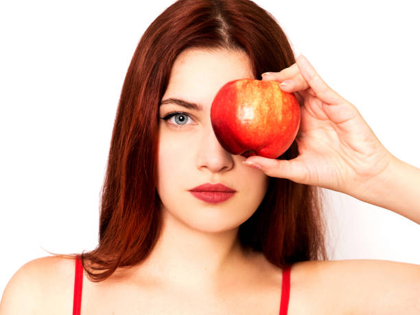 istock Woman holding red apple 1020200648