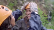 istock Playful young women wiping mud on each other, enjoying ziplining 1020200658