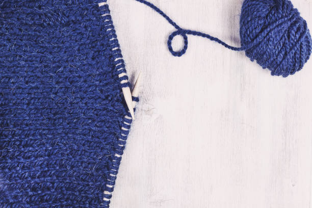 istock Knitting by wooden knitting needles. Woolen yarn on background 1020211122