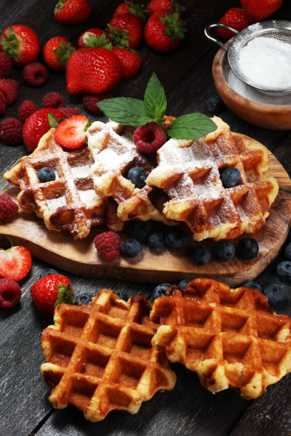 istock Traditional belgian waffles with fresh mint, sugar and raspberries. 1020211944