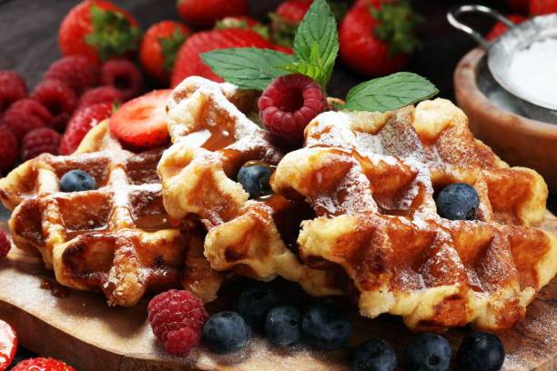 istock Traditional belgian waffles with fresh mint, sugar and raspberries. 1020212060