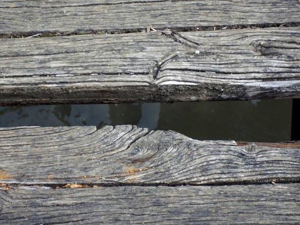 Broken planks of the old wooden bridge