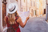 travel to Europe, tourist looking at map on the street, summer holidays