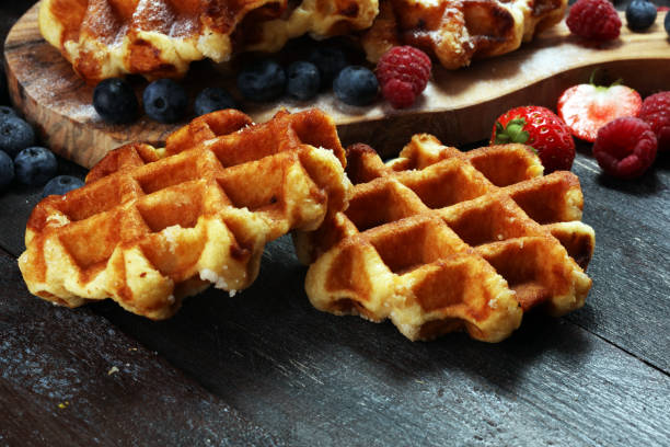 istock Traditional belgian waffles with fresh mint, sugar and raspberries. 1020217378