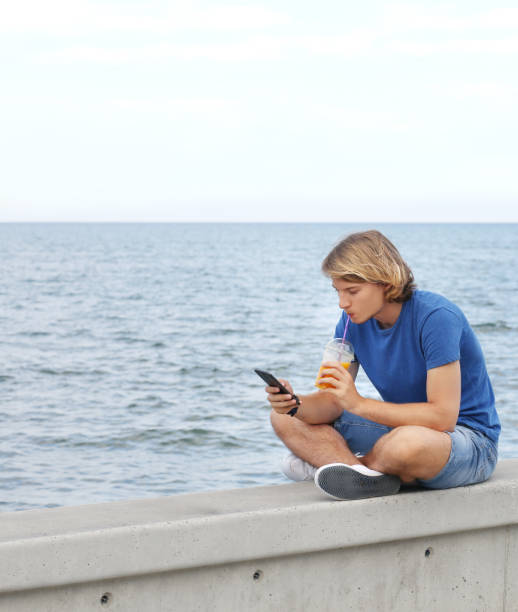 istock Teenage boy typing text message.Using smart phone. 1020224502