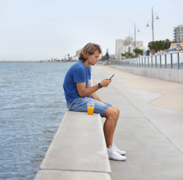 istock Teenage boy typing text message.Using smart phone. 1020224506