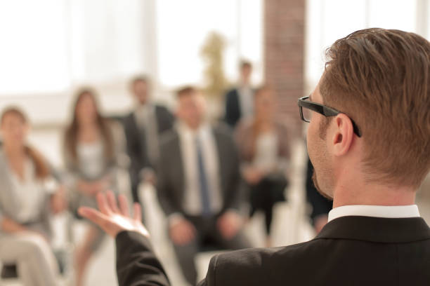 istock rear view.businessman looking in the conference room 1020226796