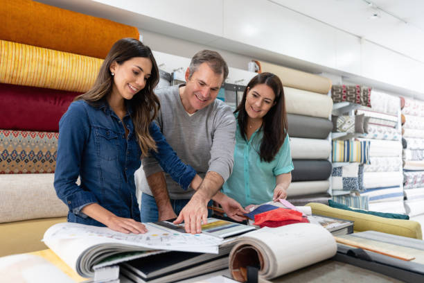 istock Interior designer with a couple choosing fabrics for a house project 1020230054