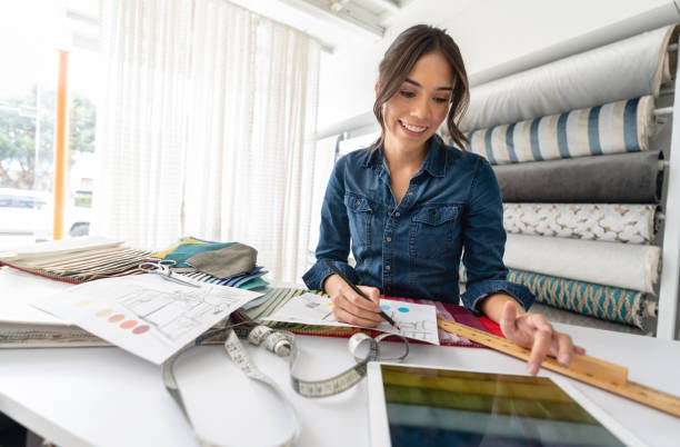 istock Interior designer choosing fabrics at a textile shop 1020230086