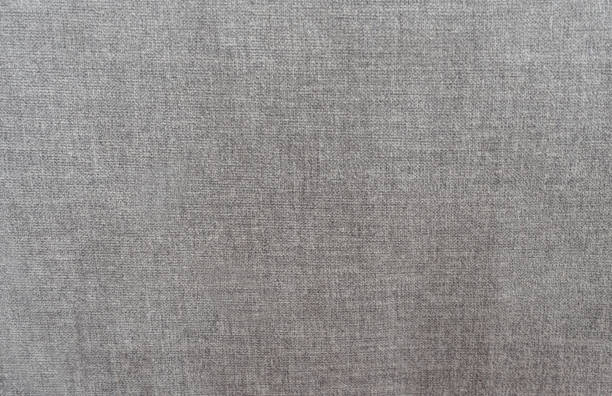 Close-up on a piece of gray linen fabric at a textile shop - business concepts
