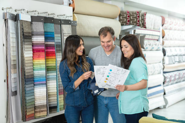 istock Interior designer with a couple choosing fabrics for a house project 1020230210