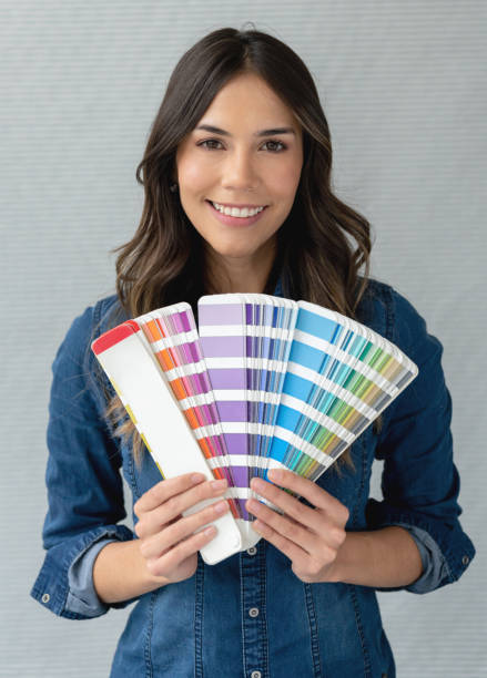istock Happy interior designer holding a color palette 1020230262
