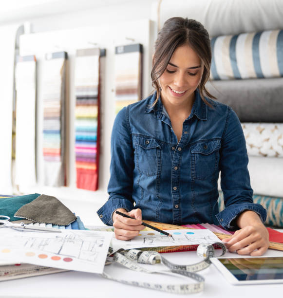 istock Interior designer choosing fabrics at a textile shop 1020233292