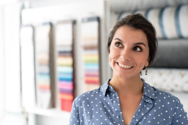 istock Thoughtful designer buying fabrics at a textile shop 1020233326
