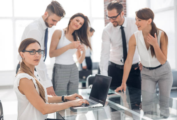 istock smiling business woman at workplace in office 1020236110