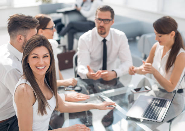 istock young business woman at a working meeting 1020236436