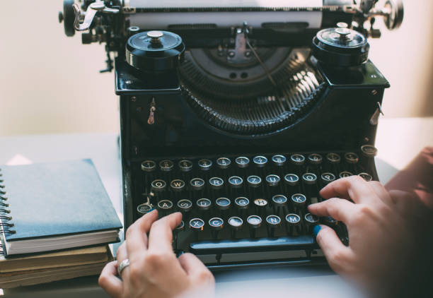istock Woman's hands writing on a vintage typewriter. 1020238758