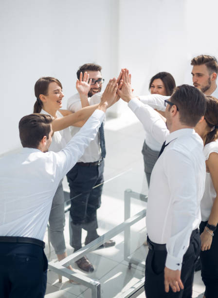 istock successful business teams make a high five over their Desk 1020238858