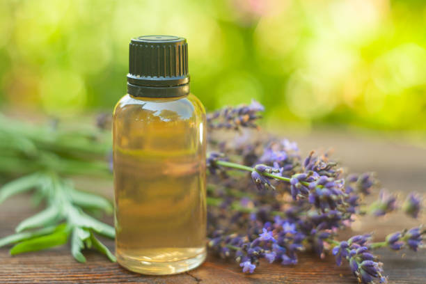 istock lavender essential oil in  beautiful bottle on table 1020243682