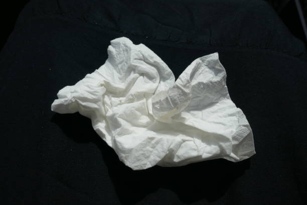 istock Paper handkerchief, crumpled, close-up,  isolated on black background 1020243848