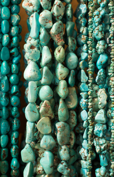 istock Turquoise Beads and Necklaces Hanging (Close-Up) 1020253516
