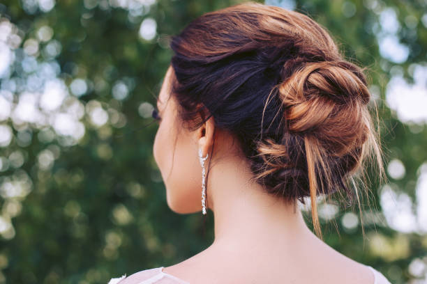istock The bride stands on the nature turning away 1020255672