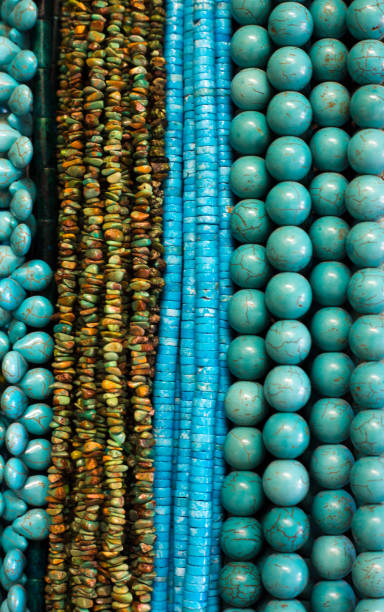 istock Turquoise Beads and Necklaces Hanging (Close-Up) 1020255774