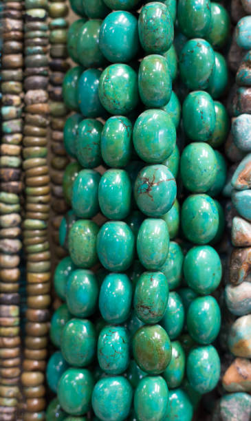 istock Turquoise Beads and Necklaces Hanging (Close-Up) 1020256082