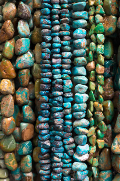 istock Turquoise Beads and Necklaces Hanging (Close-Up) 1020258494