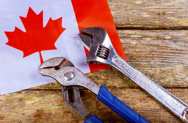 istock Labor day concept. canadian flag Different kinds on wrenches and wooden table. 1020272036