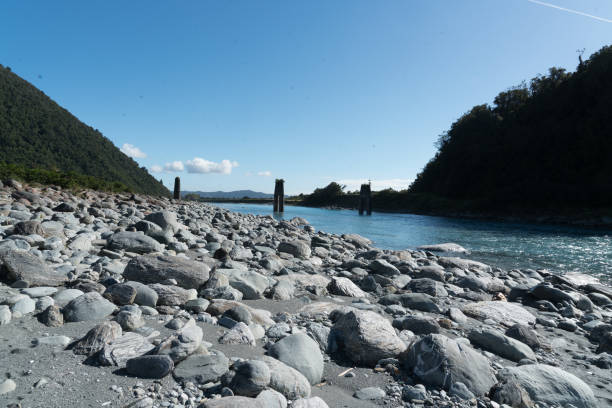 Blue river flowing across the rocks in the native park