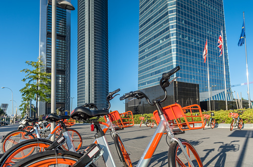Electric Bicycles rental services at Cuatro Torres Business Area, Madrid, Spain. This rental service is possible by using an smartphone application.