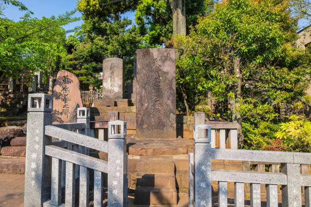 Tombstone at Sengakuji Temple, the site of 47 ronin graveyard in Tokyo, Japan Tokyo, Japan - April 20 2018: Tombstone at Sengakuji Temple harakiri photos stock pictures, royalty-free photos & images