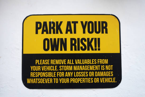 istock Park at your own risk sign on wall 1020327594