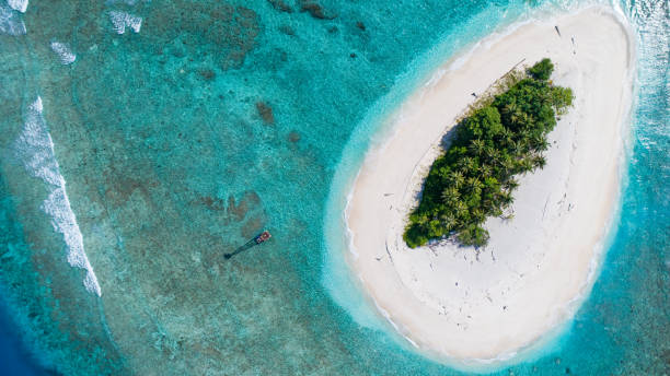 Desert Island 2 Aerial view of a small desert island off the coast of Sumatra, Indonesia desert island stock pictures, royalty-free photos & images