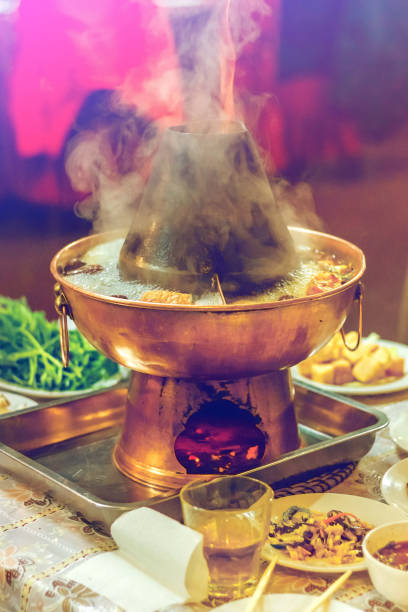 istock Asian double flavor hot pot on the table 1020341312