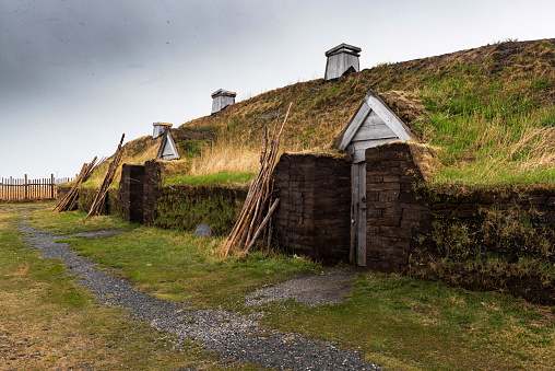 Newfoundland, Canada - June 13, 2018: L'Anse aux Meadows National Historic Site.  L'Anse aux Meadows is an archaeological site on the northernmost tip of the island of Newfoundland in the Canadian province of Newfoundland and Labrador. Discovered in 1960, it is the only certain site of a Norse or Viking settlement in North America.