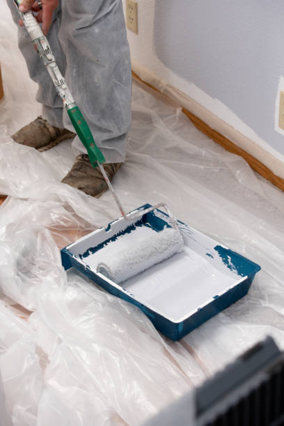 istock Man painting with paint roller 1020346758