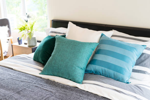 istock green and blue pillow on bed in bedroom 1020347168