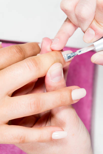 istock nail beauty process, polishing and painting 1020356232