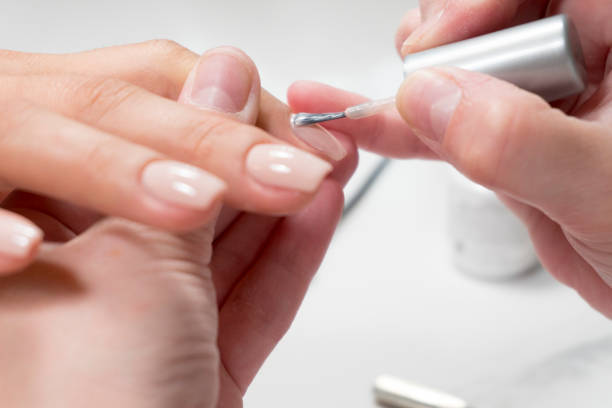 istock nail beauty process, polishing and painting 1020356248
