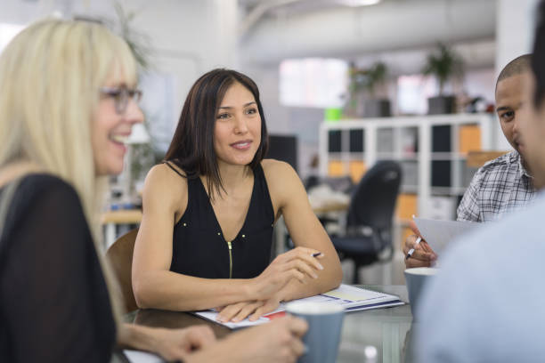 istock Ethnic female leads a business strategy meeting 1020356496